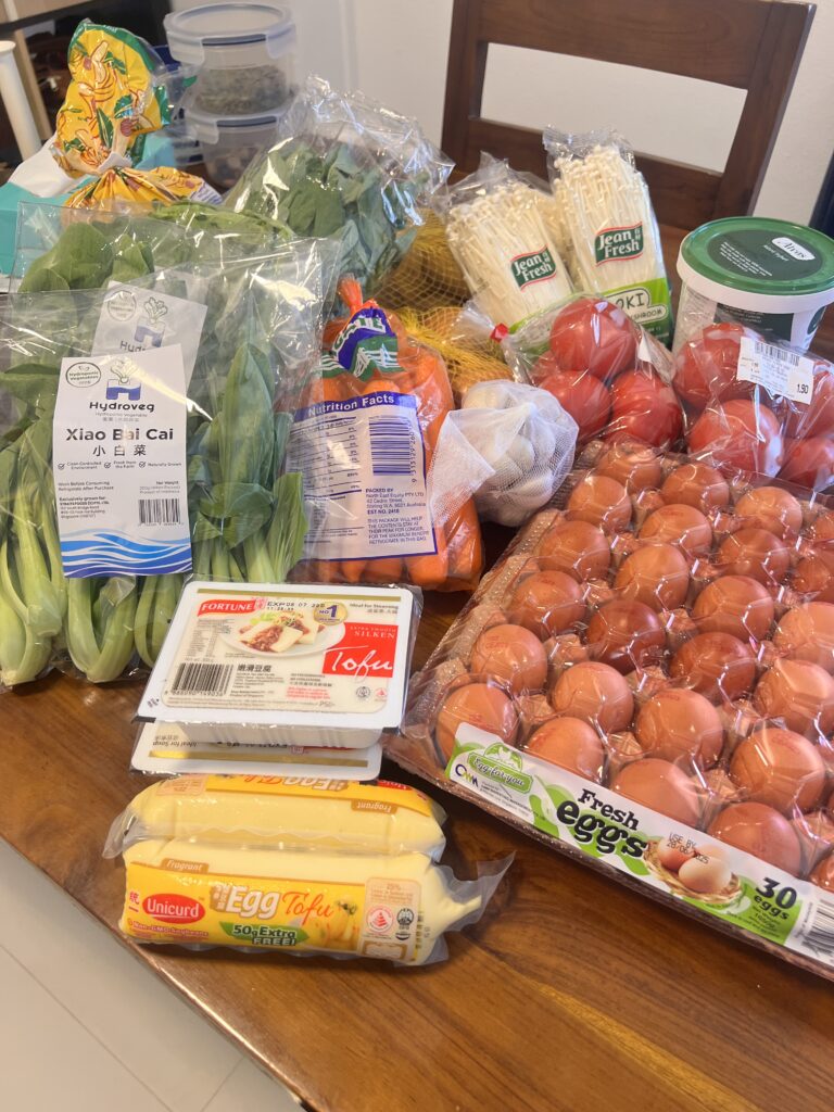groceries bought on budget laid out on table