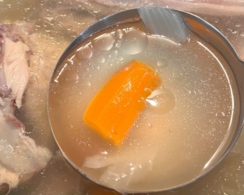 easy chicken bone broth in ladle